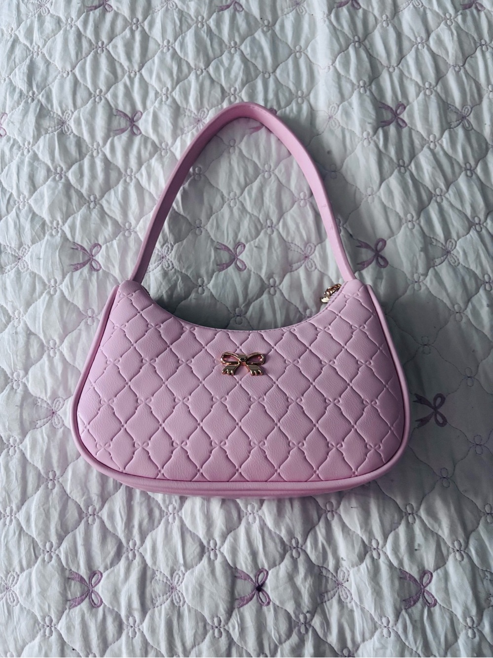 Quilted Pink Shoulder Bag with Gold Bow Accent